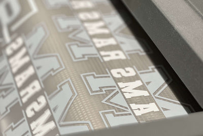 Premium DTF Transfers | Printed Marketplace designs showing custom names and numbers ready for pressing.